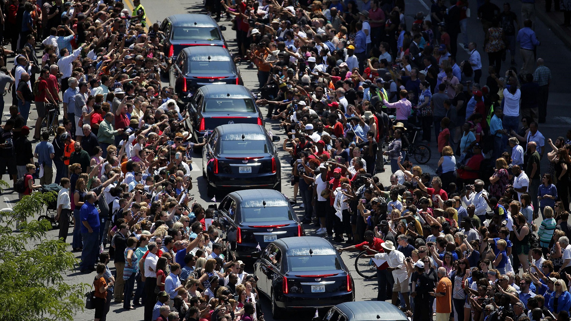 Crowds line the street as Muhammad Ali's funeral procession passes.