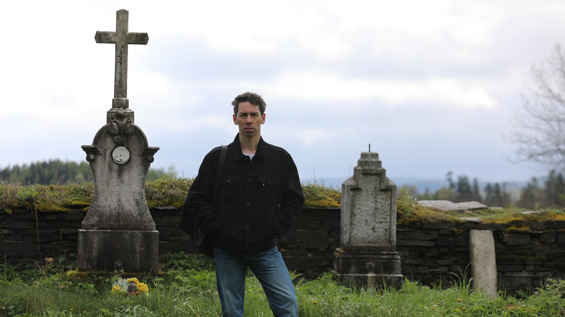 Historian Adam Mezes stands in a cemetery in the rural village of Podlesí, Czech Republic, investigating a 300-year-old legal case against a suspected revenant.
