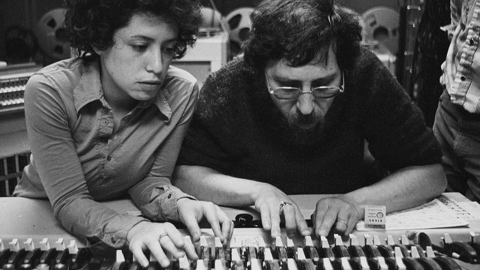 Black and white photo of Janis Ian and Brooks Arthur in a recording session. Mid 1970s.