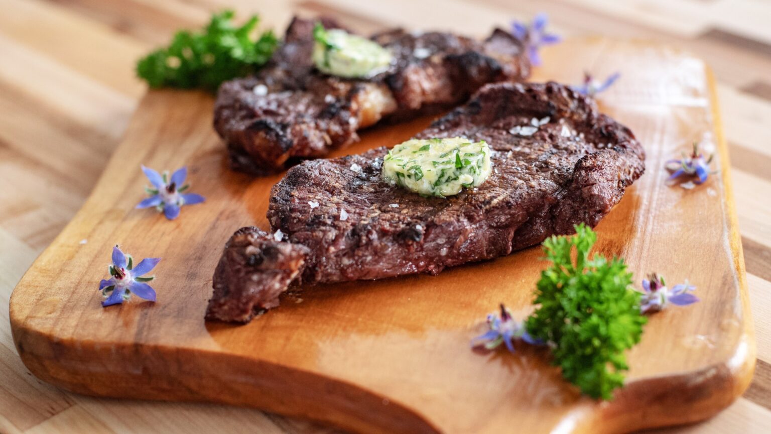 Bison Ribeye Steak with Garlic and Herb Compound Butter > KET