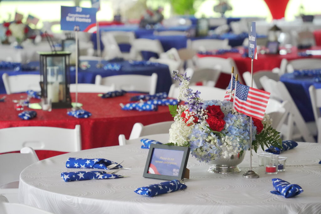 Dining tables decorated for KET's Cheers to 250 Years Summer Celebration 2026