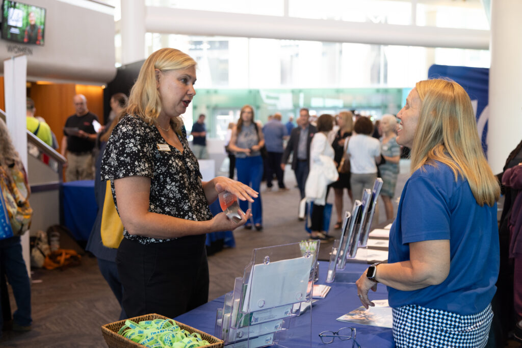 An attendee visiting KET's Education booth at KET's Louisville event.