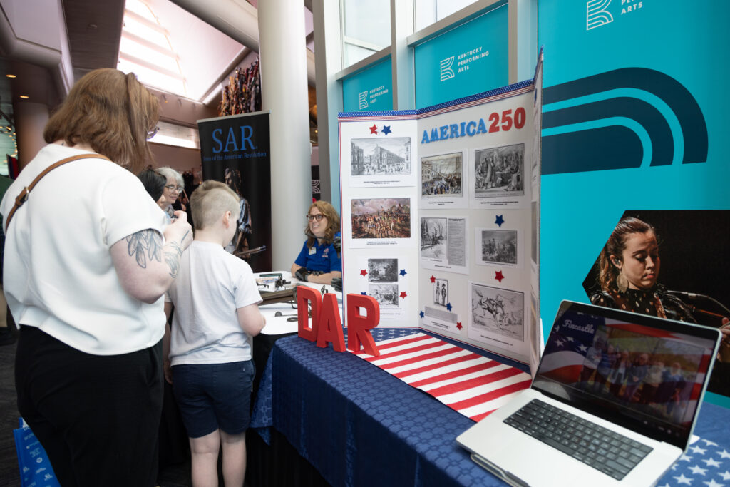 Attendees visiting the DAR partner booth at KET's Louisville event.