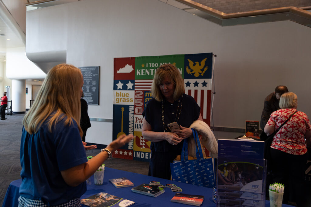 An attendee visiting KET's Education booth at KET's Louisville event.
