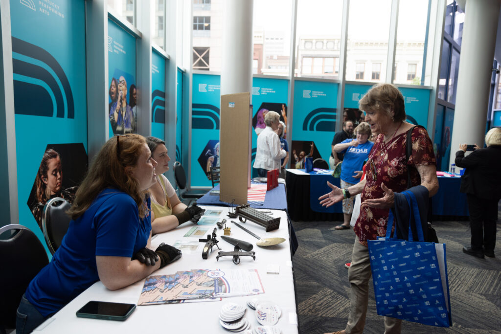 An attendee visiting the SAR partner booth at KET's Louisville event.
