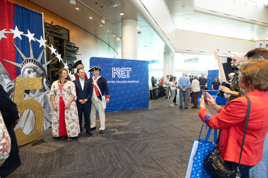 The Honorable Craig Greenberg, Louisville Mayor, posing with members of the National Society of the Sons of the American Revolution Color Guard at KET's Louisville event.