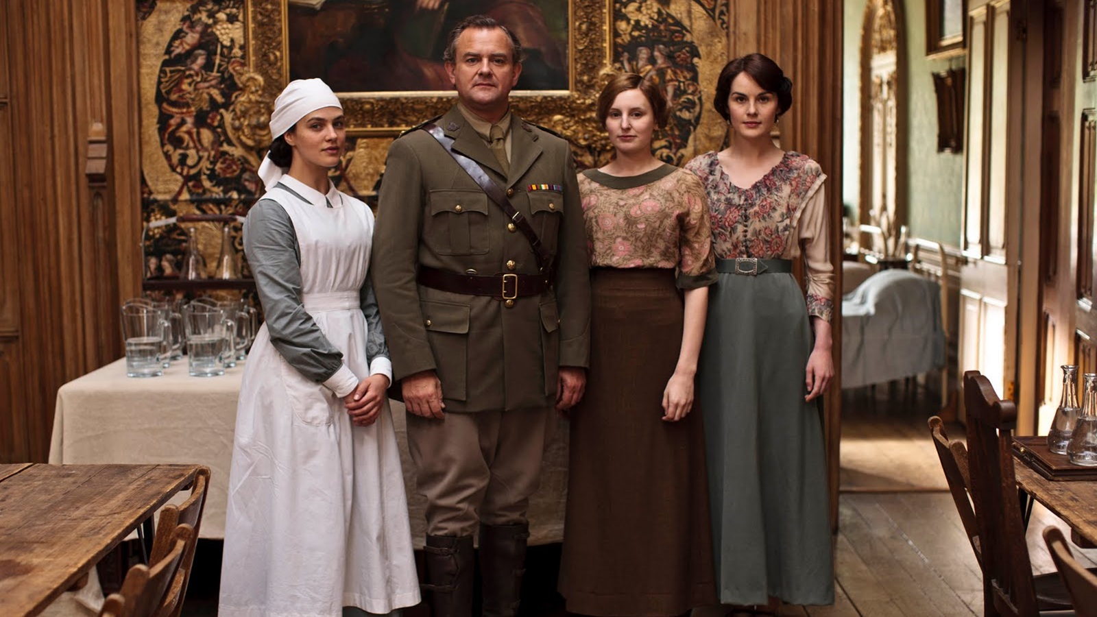 Sybil in nurses uniform, Lord Grantham in military uniform, Edith, and Mary