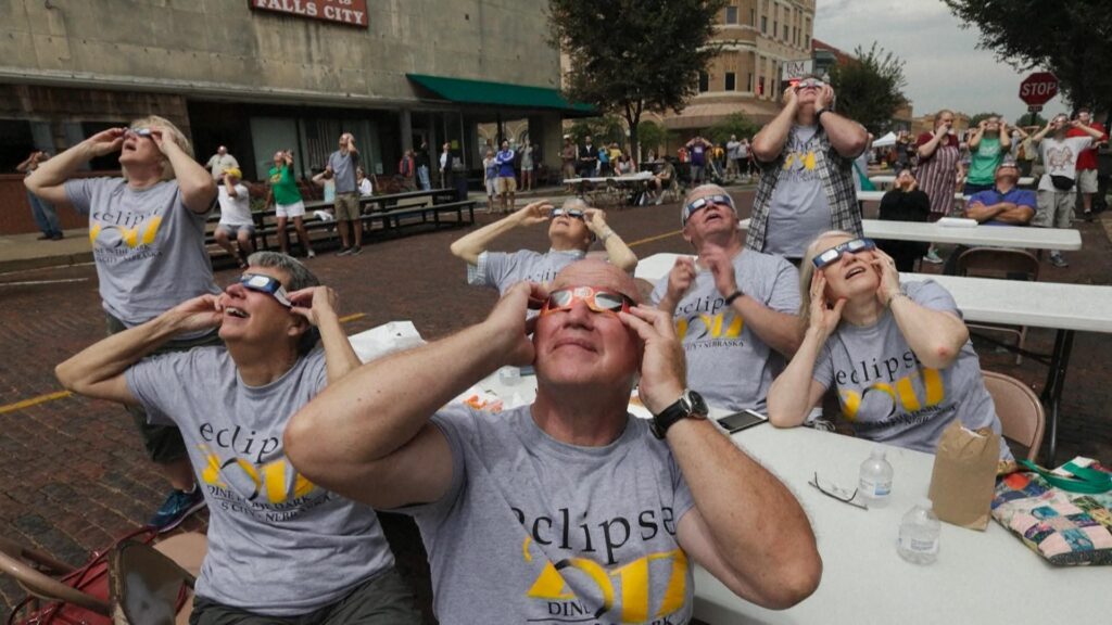 People using special sunglasses to watch the eclipse