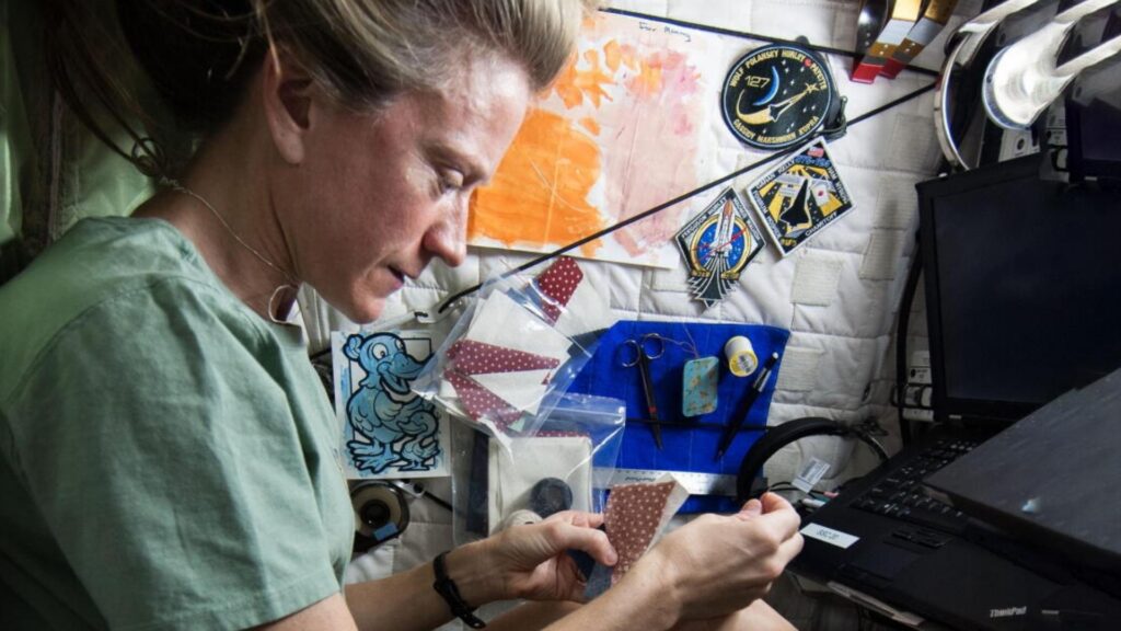 A person making a quilt