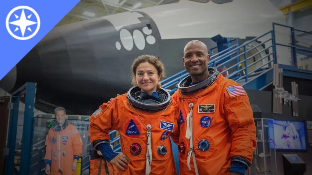 Two NASA astronauts posed and smiling in orange space suits. KET's Passport logo sits in the upper-left corner.