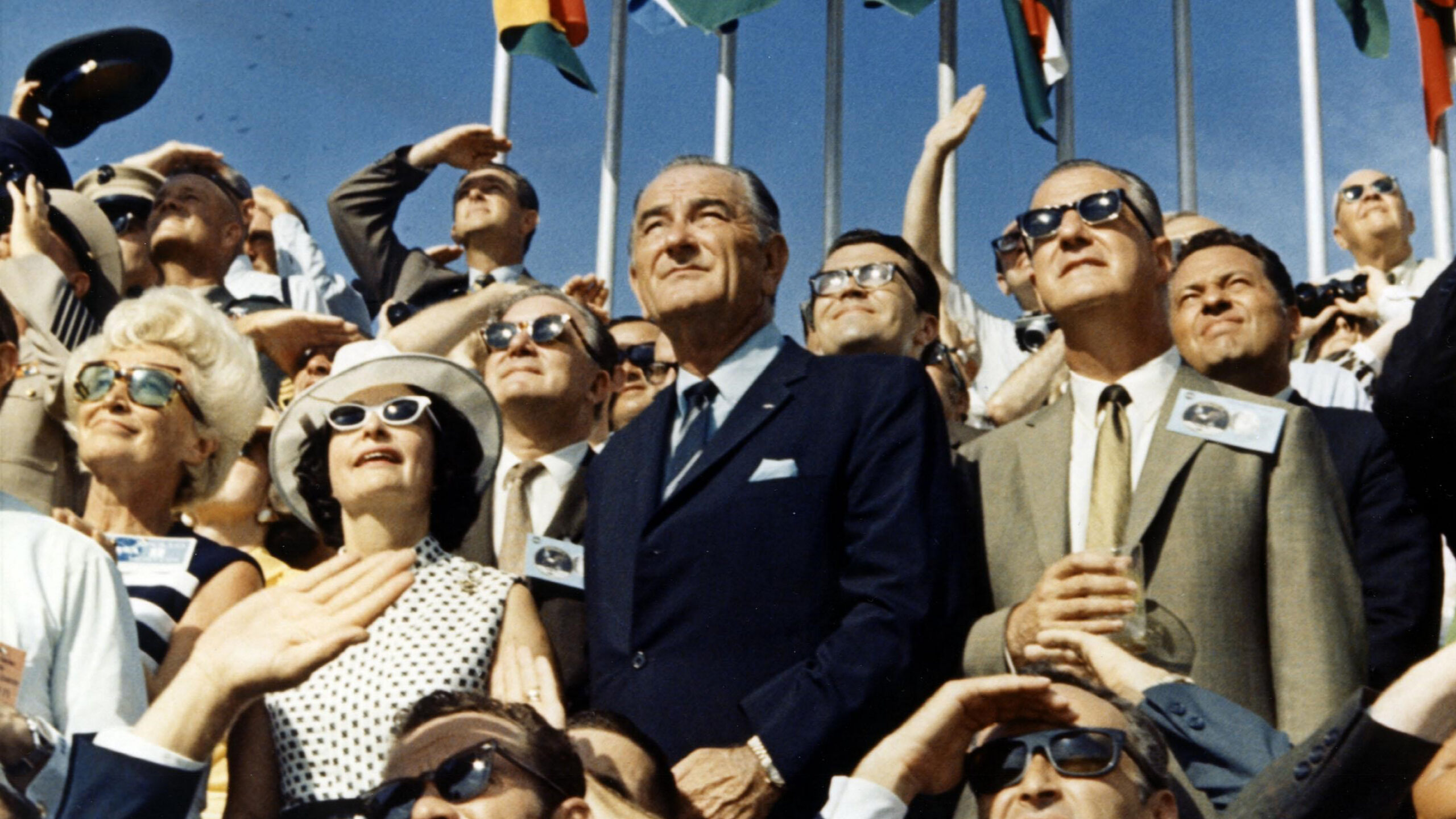 President Johnson standing in a crowd at a shuttle launch