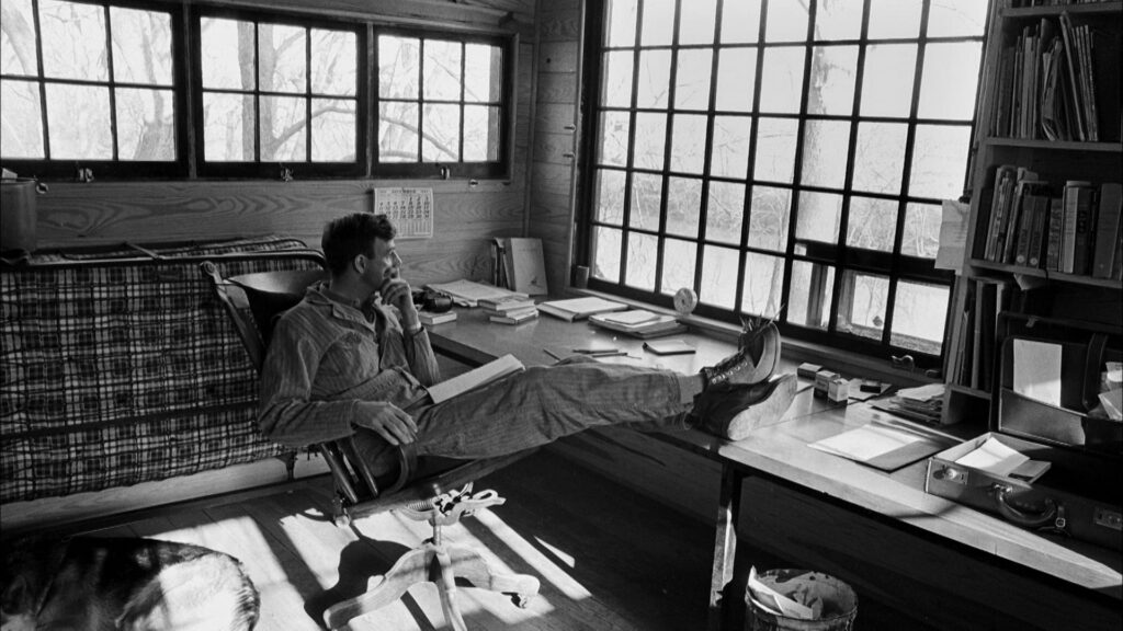 Wendell Berry looking out the window black and white image
