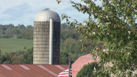 Farm landscape with rolling hills and silo