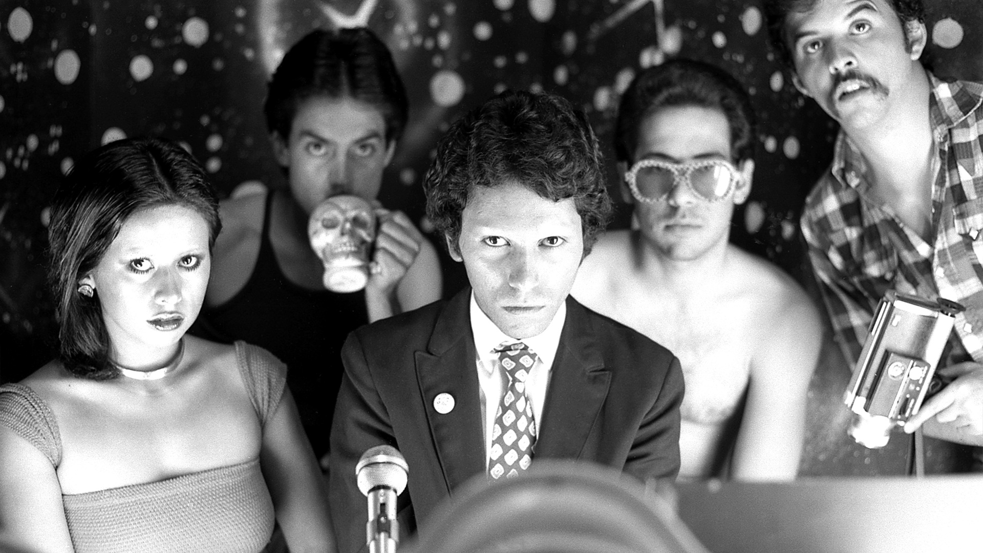 Black and white photo of Patssi Valdez, Willie Herrón, Gronk, Humberto Sandoval, and Harry Gamboa Jr