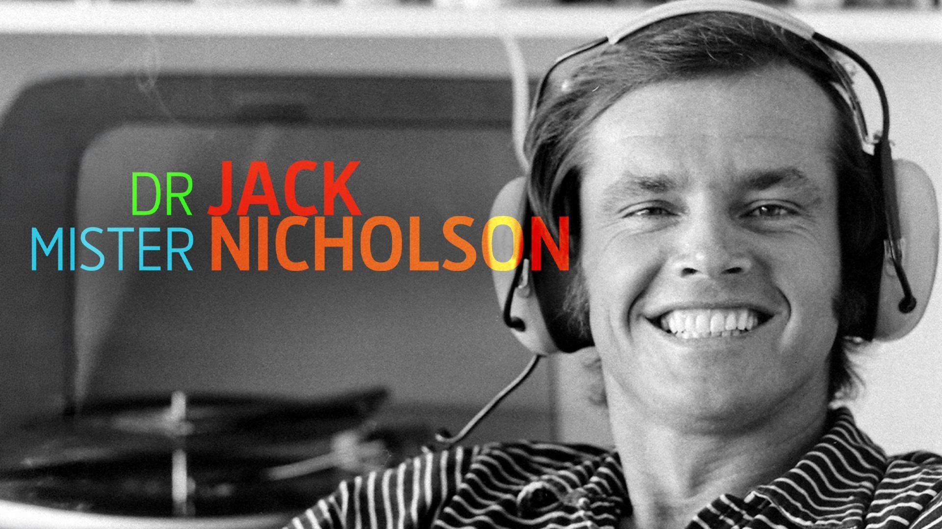 Black and white photo of Jack Nicholson from the 70s or 80s wearing large headphones and smiling