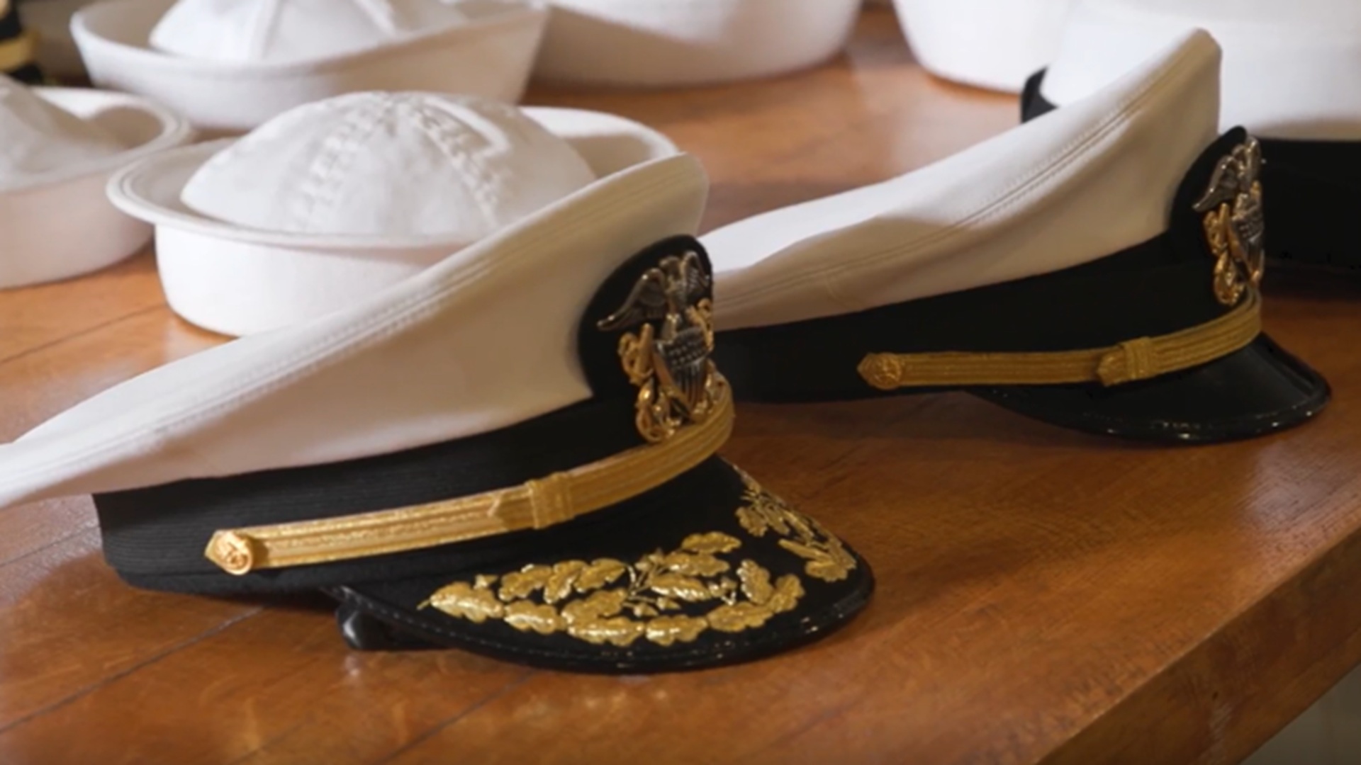 Navy caps on a table