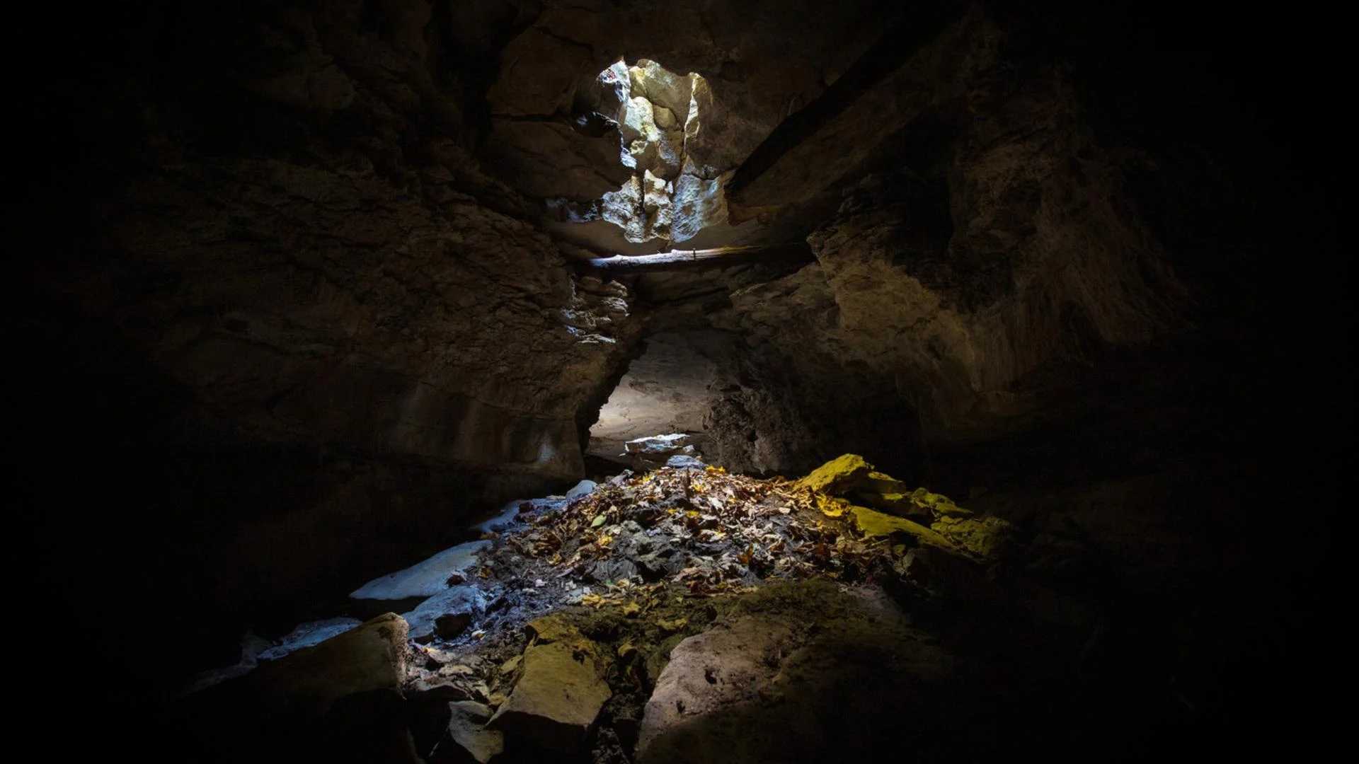 A shaft of light shining into a cave